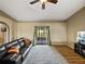 Open concept living room features vaulted ceiling, ceiling fan, and access to back yard at 6272 Cornerstone Dr, Lakeland, FL 33813