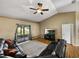Open concept living room with vaulted ceiling, ceiling fan, and sliding glass doors at 6272 Cornerstone Dr, Lakeland, FL 33813