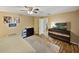 Well-lit main bedroom with wood floors, an entertainment center, and tastefully decorated walls at 6272 Cornerstone Dr, Lakeland, FL 33813