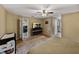 Bright main bedroom boasts wood-look floors, an entertainment center, and access to other rooms at 6272 Cornerstone Dr, Lakeland, FL 33813