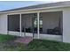 Enjoy an outdoor space with a screened-in patio with access to the backyard at 6272 Cornerstone Dr, Lakeland, FL 33813