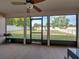Screened patio overlooking backyard with trampoline and playset at 6272 Cornerstone Dr, Lakeland, FL 33813