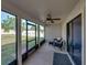 Screened patio with ceiling fan and outdoor seating at 6272 Cornerstone Dr, Lakeland, FL 33813