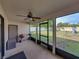 This screened-in patio offers ample space for relaxing and grilling while overlooking a spacious, green backyard at 6272 Cornerstone Dr, Lakeland, FL 33813