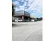 Commercial building construction featuring steel framework, brick columns, and new signage at 7900 S Orange Blossom Trl # 1099, Orlando, FL 32809