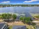 Aerial view of the property showcasing the lake, landscaping, and proximity to the water at 917 Shawna Shrs, Haines City, FL 33844