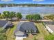 Stunning aerial view of home with lake frontage and well-manicured lawn at 917 Shawna Shrs, Haines City, FL 33844