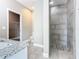 Bathroom features a tiled shower, a toilet, and granite vanity at 917 Shawna Shrs, Haines City, FL 33844