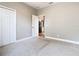 A vacant bedroom with carpet and a doorway leading to the kitchen at 917 Shawna Shrs, Haines City, FL 33844