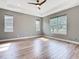 Bedroom with tray ceiling, recessed lighting, and windows offering scenic views at 917 Shawna Shrs, Haines City, FL 33844