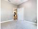 A vacant bedroom with carpet and an open closet door leading to the kitchen at 917 Shawna Shrs, Haines City, FL 33844