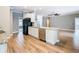 Open kitchen featuring granite countertops, stainless steel appliances, and wood flooring at 917 Shawna Shrs, Haines City, FL 33844