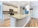 Bright kitchen featuring granite counters, modern appliances and a large kitchen island, creating a functional space at 917 Shawna Shrs, Haines City, FL 33844