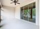 Spacious screened lanai with ceiling fan and slider access to the home's interior at 917 Shawna Shrs, Haines City, FL 33844