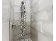 A modern-style shower with black and white decorative mosaic tile and gray tiles at 917 Shawna Shrs, Haines City, FL 33844