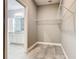A walk-in closet with wire shelving, next to the modern bathroom at 917 Shawna Shrs, Haines City, FL 33844