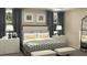 Comfortable bedroom with plush bedding, stylish decor, and ample natural light from the windows at 1887 Clear Sky Dr, Kissimmee, FL 34744