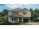 Charming two-story home featuring a two-car garage, landscaped yard, and classic architectural design at 1919 Blissful Dr, Kissimmee, FL 34744