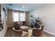 Cozy sitting room featuring plush seating, soft natural light, and modern decor elements at 1919 Blissful Dr, Kissimmee, FL 34744