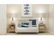 Cozy Bedroom room with a white crib, nautical themed decor, and soft lighting at 2268 Red Sun Way, Apopka, FL 32703