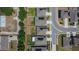 Overhead shot of a neighborhood with manicured lawns and houses with solar panels along a curving street at 272 Pershing St, Bartow, FL 33830