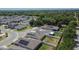 Aerial view showcasing modern homes with solar panels in a well-planned community at 272 Pershing St, Bartow, FL 33830