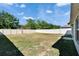 Picture of a spacious backyard enclosed by a white fence, perfect for outdoor activities at 272 Pershing St, Bartow, FL 33830