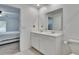 Clean and modern bathroom with double sinks, white cabinets, and stylish fixtures at 272 Pershing St, Bartow, FL 33830