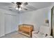 Lovely Bedroom featuring a crib, closet, soft carpet, comfortable chair, and soft, natural lighting at 272 Pershing St, Bartow, FL 33830