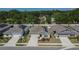 Street view of well-maintained single-story homes with solar panels, landscaping, and driveways at 272 Pershing St, Bartow, FL 33830