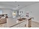 Spacious kitchen island with double sink overlooking the living, dining and bedroom areas, enhancing the home's flow at 272 Pershing St, Bartow, FL 33830