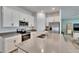 Bright kitchen with stainless steel appliances, white cabinets, and a large center island at 272 Pershing St, Bartow, FL 33830