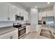 Modern kitchen with stainless steel appliances, white cabinetry, and a stylish design, creating a welcoming space at 272 Pershing St, Bartow, FL 33830