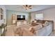 Cozy living room with a modern ceiling fan and a comfortable sectional sofa at 272 Pershing St, Bartow, FL 33830