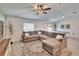 Spacious living room with a sectional sofa, decorative rug, and natural light from the window at 272 Pershing St, Bartow, FL 33830