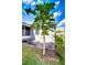 Exterior backyard view with fruit tree near lanai and well kept lawn and landscaping at 3518 Remington Oaks Way, Lakeland, FL 33810