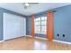 Comfortable bedroom with wood flooring, closet, and natural light at 3518 Remington Oaks Way, Lakeland, FL 33810
