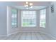 Bright dining area with a bay window, tiled floor, and modern light fixture at 3518 Remington Oaks Way, Lakeland, FL 33810