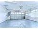Spacious garage with automatic door, ample lighting, and plenty of room for parking at 3518 Remington Oaks Way, Lakeland, FL 33810