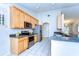 Modern kitchen with stainless steel appliances, granite countertops and ample cabinet space at 3518 Remington Oaks Way, Lakeland, FL 33810