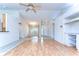 Spacious living room features wood floors, vaulted ceiling, and an open floor plan at 3518 Remington Oaks Way, Lakeland, FL 33810
