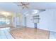 Bright, open living area featuring wood floors, vaulted ceilings, built-in shelving, and neutral paint at 3518 Remington Oaks Way, Lakeland, FL 33810