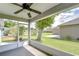 View from screened porch showcasing backyard with mature trees and greenery at 3518 Remington Oaks Way, Lakeland, FL 33810