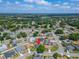 A birds-eye view of the house in a neighborhood with a pool with a pin on top at 7402 Gunstock Dr, Lakeland, FL 33809