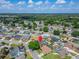 An aerial view of a house in a neighborhood with a pin on top at 7402 Gunstock Dr, Lakeland, FL 33809
