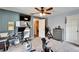 Bedroom featuring a ceiling fan, television, closet, and workout equipment at 7402 Gunstock Dr, Lakeland, FL 33809