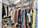 Organized walk-in closet with shelves, hanging rods, and space for shoes and accessories at 7402 Gunstock Dr, Lakeland, FL 33809