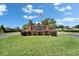 Welcome to Hunters Run, a beautiful community with lush landscaping and a welcoming entrance at 7402 Gunstock Dr, Lakeland, FL 33809