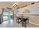 Casual dining area with table, seating, and sliding glass doors to the outdoor pool at 7402 Gunstock Dr, Lakeland, FL 33809