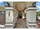 Inviting front entrance with decorative archways, stone pathway and warm lighting at 7402 Gunstock Dr, Lakeland, FL 33809